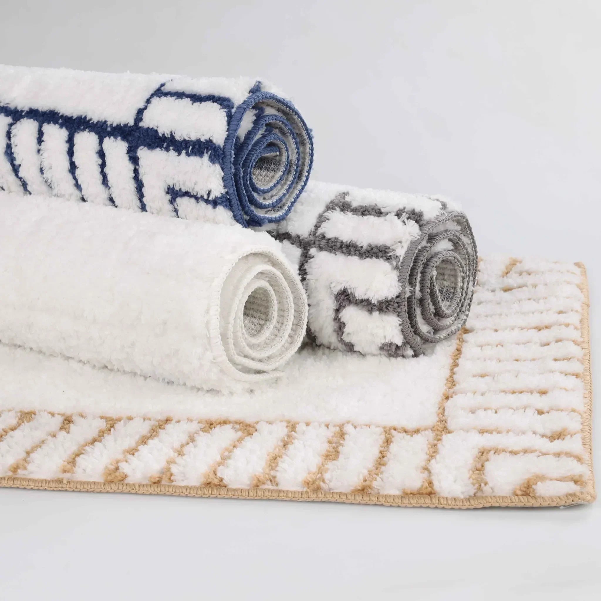 InayaBathRugStackofallcolors02